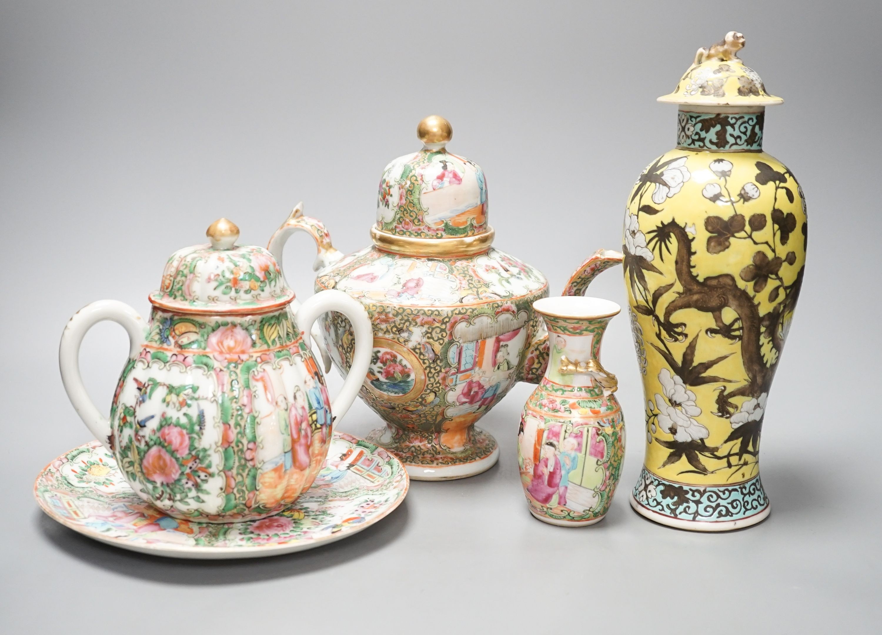 A 19th century Chinese famille rose teapot, sugar bowl, saucer dish vase and a similar yellow ground ‘dragon’ vase and cover 21cm